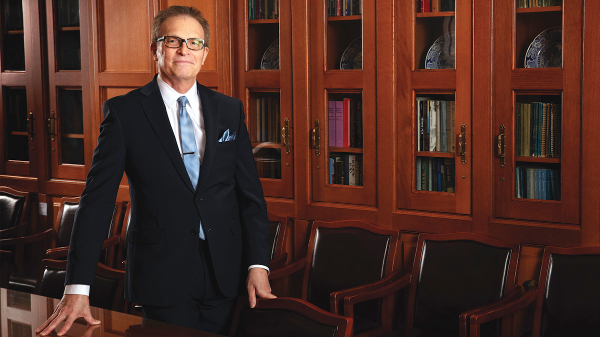 Dean Valentin pictured in an academic conference room